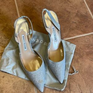 Silver fabric Manolo Blahnik sling backs.  Size 40. New but have stain